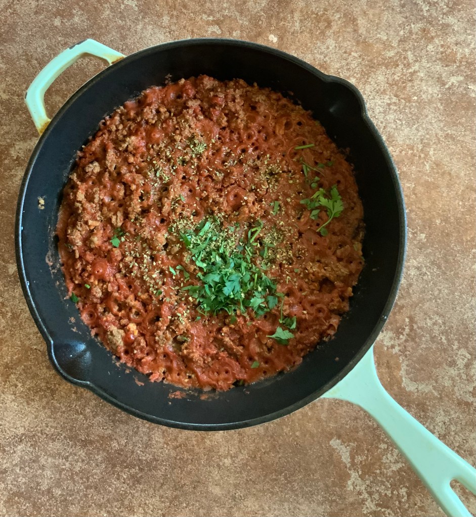 Meat sauce ready for lasagne. Add parsley and oregano when ready. Note little holes where liquid has evaporated